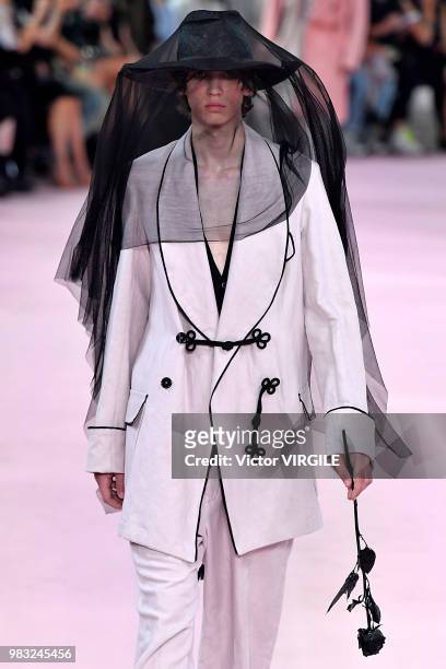 Model walks the runway during the Ann Demeulemeester Menswear Spring/Summer 2019 fashion show as part of Paris Fashion Week on June 22, 2018 in...