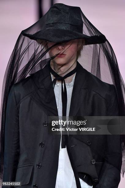 Model walks the runway during the Ann Demeulemeester Menswear Spring/Summer 2019 fashion show as part of Paris Fashion Week on June 22, 2018 in...