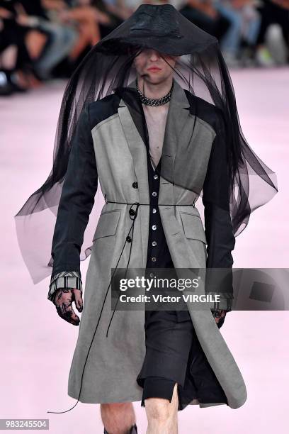 Model walks the runway during the Ann Demeulemeester Menswear Spring/Summer 2019 fashion show as part of Paris Fashion Week on June 22, 2018 in...