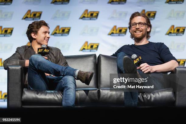 Tom Holland and Tom Hiddleston speak on stage during ACE Comic Con at WaMu Theatre on June 24, 2018 in Seattle, Washington.