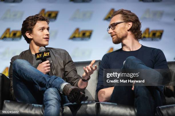 Tom Holland and Tom Hiddleston speak on stage during ACE Comic Con at WaMu Theatre on June 24, 2018 in Seattle, Washington.