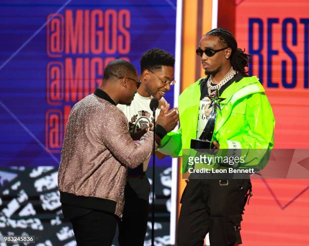 Quavo of Migos accepts the Best Group Award from Jason Mitchell and Jacob Latimore onstage at the 2018 BET Awards at Microsoft Theater on June 24,...
