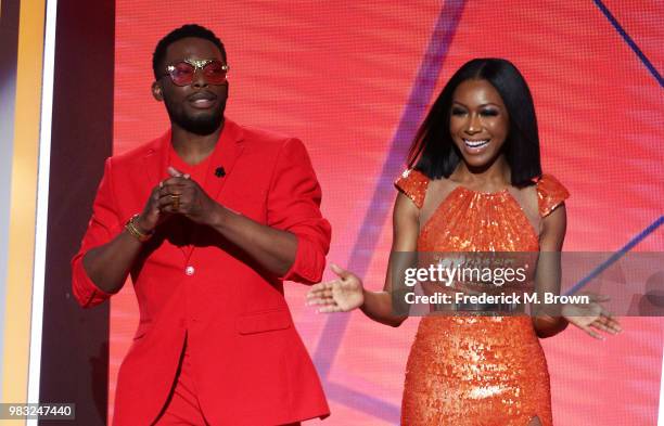 Woody McClain and Gabrielle Dennis speak onstage at the 2018 BET Awards at Microsoft Theater on June 24, 2018 in Los Angeles, California.