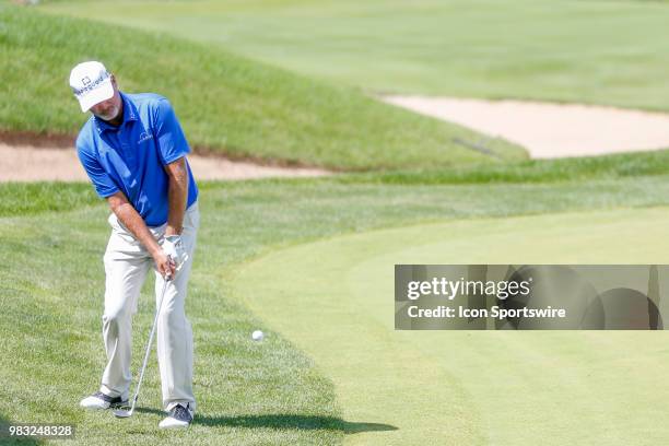 Jerry Kelly chips on to the green at eighteen during the final round of the American Family Insurance Championship Champions Tour golf tournament on...