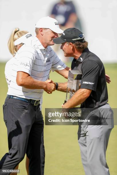 Steve Stricker congratulates Scott McCarron on winning the American Family Insurance Championship Champions Tour golf tournament on June 24, 2018 at...