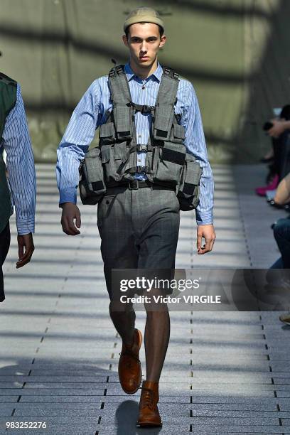 Model walks the runway during the Junya Watanabe Man Menswear Spring/Summer 2019 fashion show as part of Paris Fashion Week on June 22, 2018 in...