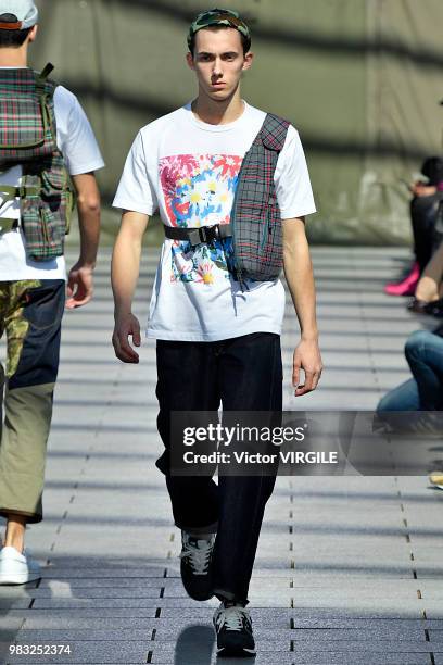 Model walks the runway during the Junya Watanabe Man Menswear Spring/Summer 2019 fashion show as part of Paris Fashion Week on June 22, 2018 in...