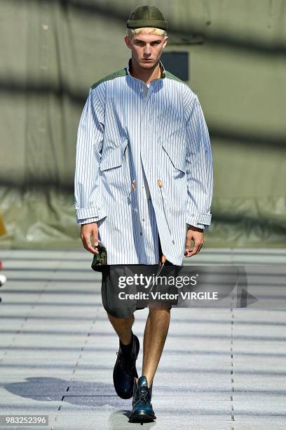 Model walks the runway during the Junya Watanabe Man Menswear Spring/Summer 2019 fashion show as part of Paris Fashion Week on June 22, 2018 in...