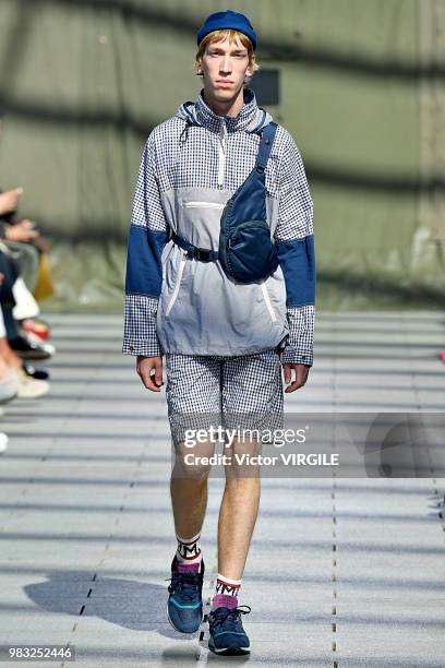 Model walks the runway during the Junya Watanabe Man Menswear Spring/Summer 2019 fashion show as part of Paris Fashion Week on June 22, 2018 in...