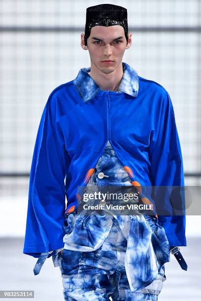 Model walks the runway during the Comme des Garcons Menswear Spring/Summer 2019 fashion show as part of Paris Fashion Week on June 22, 2018 in Paris,...