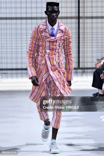 Model walks the runway during the Comme des Garcons Menswear Spring/Summer 2019 fashion show as part of Paris Fashion Week on June 22, 2018 in Paris,...