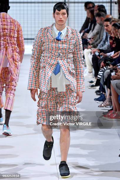 Model walks the runway during the Comme des Garcons Menswear Spring/Summer 2019 fashion show as part of Paris Fashion Week on June 22, 2018 in Paris,...