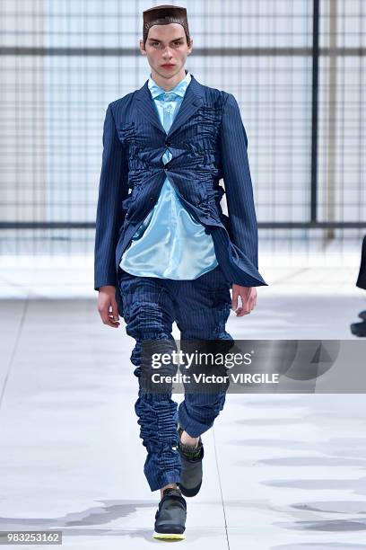 Model walks the runway during the Comme des Garcons Menswear Spring/Summer 2019 fashion show as part of Paris Fashion Week on June 22, 2018 in Paris,...