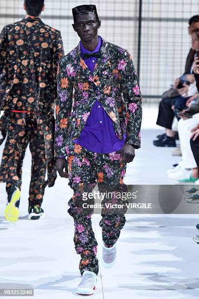 Model walks the runway during the Comme des Garcons Menswear Spring/Summer 2019 fashion show as part of Paris Fashion Week on June 22, 2018 in Paris,...
