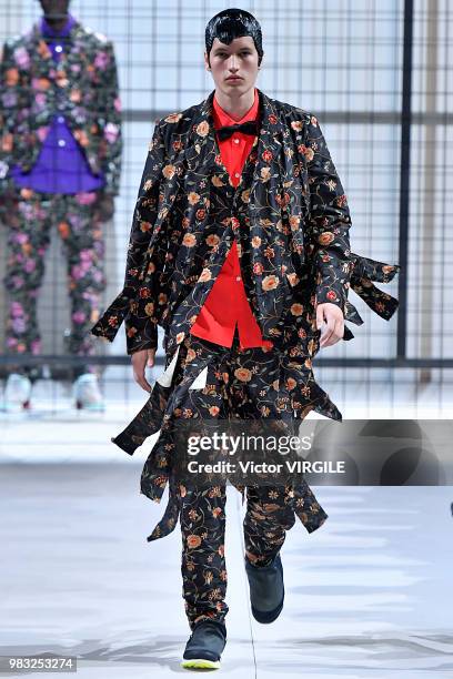 Model walks the runway during the Comme des Garcons Menswear Spring/Summer 2019 fashion show as part of Paris Fashion Week on June 22, 2018 in Paris,...