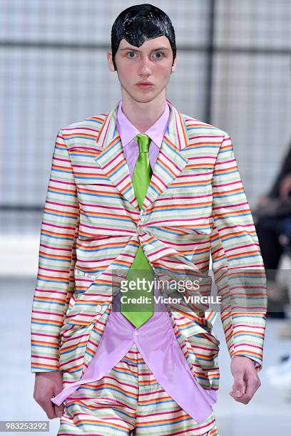 Model walks the runway during the Comme des Garcons Menswear Spring/Summer 2019 fashion show as part of Paris Fashion Week on June 22, 2018 in Paris,...
