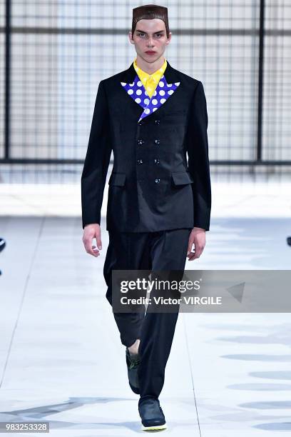 Model walks the runway during the Comme des Garcons Menswear Spring/Summer 2019 fashion show as part of Paris Fashion Week on June 22, 2018 in Paris,...