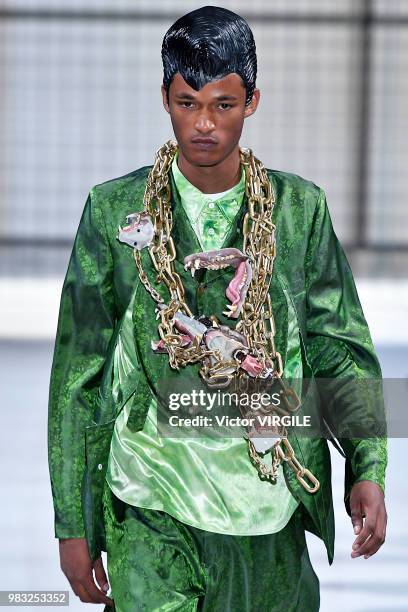 Model walks the runway during the Comme des Garcons Menswear Spring/Summer 2019 fashion show as part of Paris Fashion Week on June 22, 2018 in Paris,...