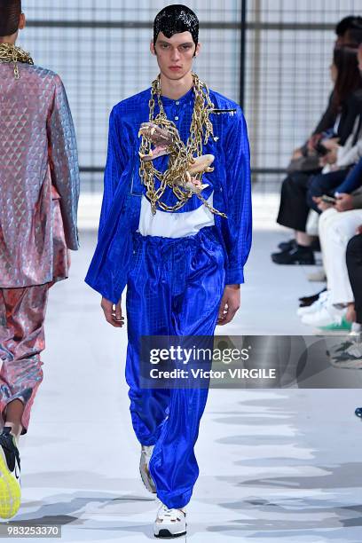 Model walks the runway during the Comme des Garcons Menswear Spring/Summer 2019 fashion show as part of Paris Fashion Week on June 22, 2018 in Paris,...