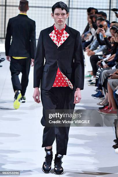 Model walks the runway during the Comme des Garcons Menswear Spring/Summer 2019 fashion show as part of Paris Fashion Week on June 22, 2018 in Paris,...