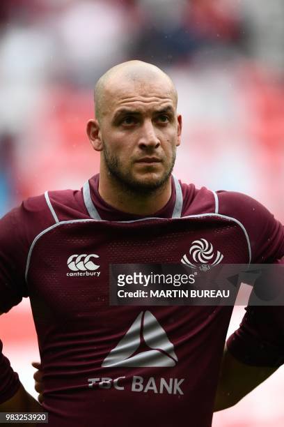 Georgia's lock Nodar Cheishvili listens to the anthems prior the rugby union Test match between Japan and Georgia at Toyota Stadium in Toyota on June...