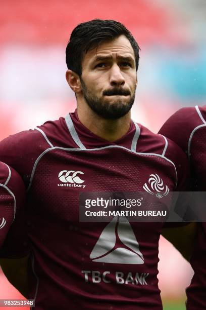 Georgia's centre Lasha Malaghuradze listens to the anthems prior the rugby union Test match between Japan and Georgia at Toyota Stadium in Toyota on...