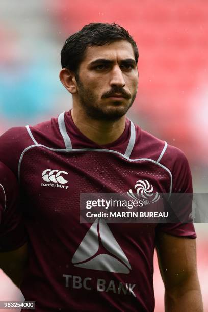 Georgia's winger Anzor Sichinava listens to the anthems prior the rugby union Test match between Japan and Georgia at Toyota Stadium in Toyota on...