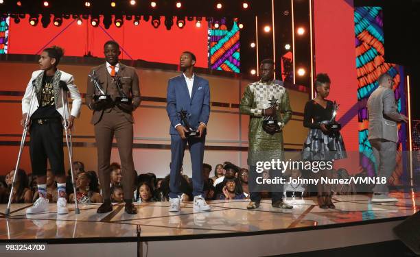 Anthony Borges, James Shaw Jr., Justin Blackman, Mamadou Gassama, Naomi Wadler, and Shaun King are honored onstage at the 2018 BET Awards at...