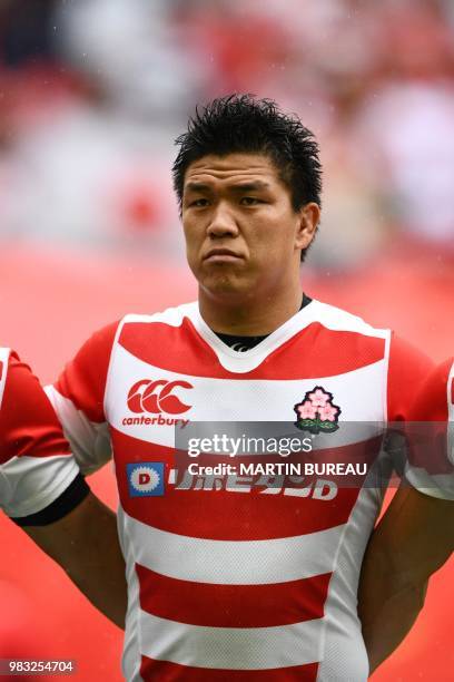 Japan's fly half Harumichi Tatekawa listens to the anthems prior the rugby union Test match between Japan and Georgia at Toyota Stadium in Toyota on...