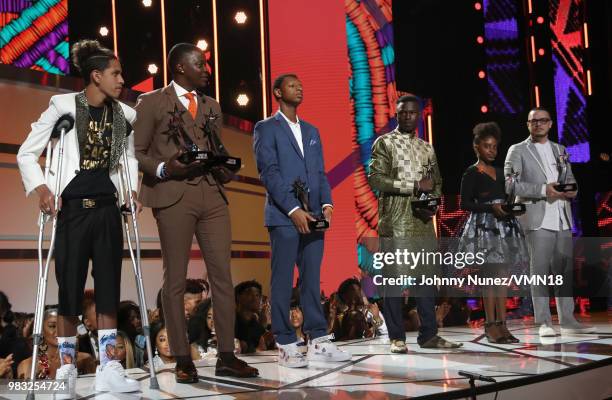 Anthony Borges, James Shaw Jr., Justin Blackman, Mamadou Gassama, Naomi Wadler, and Shaun King are honored onstage at the 2018 BET Awards at...