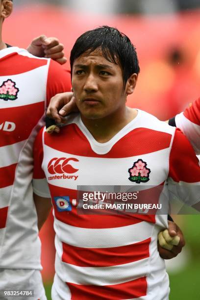 Japan's scrum half Yutaka Nagare listens to the anthems prior the rugby union Test match between Japan and Georgia at Toyota Stadium in Toyota on...