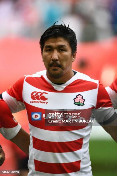 Japan's flanker Shunsuke Nunomaki listens to the anthems prior the rugby union Test match between Japan and Georgia at Toyota Stadium in Toyota on...