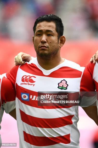 Japan's prop Shintaro Ishihara listens to the anthems prior the rugby union Test match between Japan and Georgia at Toyota Stadium in Toyota on June...