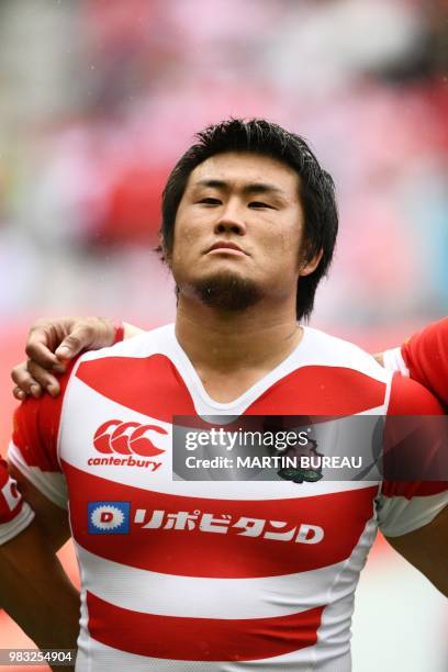 Japan's lock Shinya Makabe listens to the anthems prior the rugby union Test match between Japan and Georgia at Toyota Stadium in Toyota on June 23,...