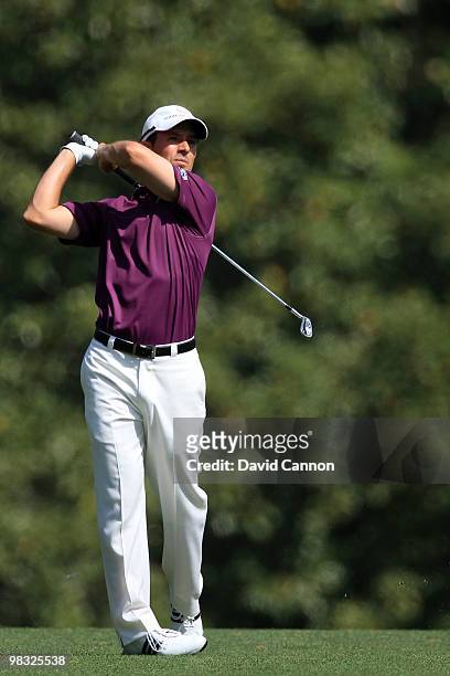 Mike Weir of Canada hits his approach shot on the fifth hole during the first round of the 2010 Masters Tournament at Augusta National Golf Club on...
