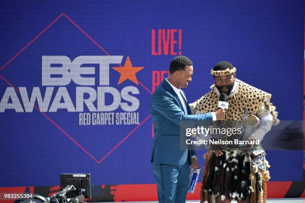 Host Terrence J presents the International Viewer's Choice award for Best New Act to Sjava onstage at Live! Red! Ready! Pre-Show, sponsored by...