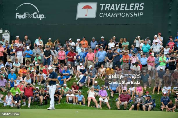 Jordan Spieth studies his putt on the 15th hole during the final round of the Travelers Championship at TPC River Highlands on June 24, 2018 in...