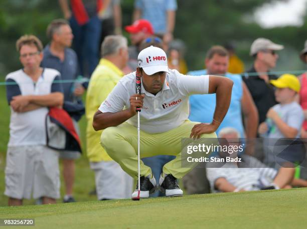 Anirban Lahiri from India studies his putt on the second hole during the final round of the Travelers Championship at TPC River Highlands on June 24,...