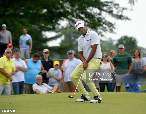 Anirban Lahiri from India reacts to his putt on the second hole during the final round of the Travelers Championship at TPC River Highlands on June...