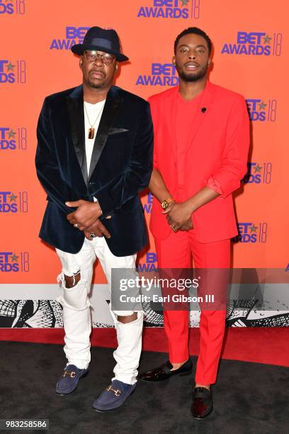 Bobby Brown and Woody McClain pose in the press room at the 2018 BET Awards at Microsoft Theater on June 24, 2018 in Los Angeles, California.