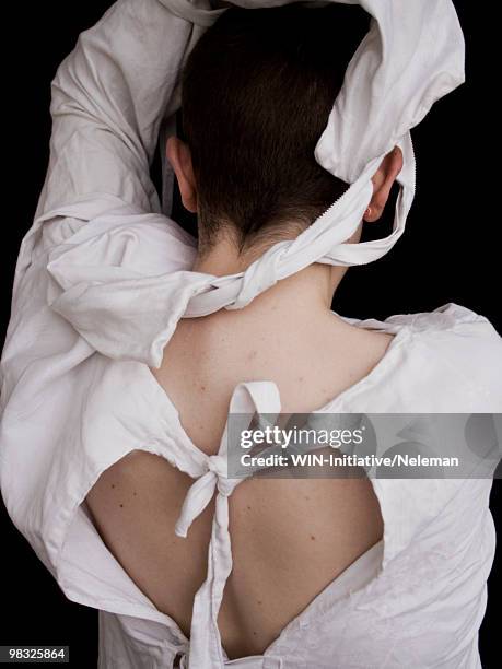 woman wearing a straitjacket - dwangbuis stockfoto's en -beelden