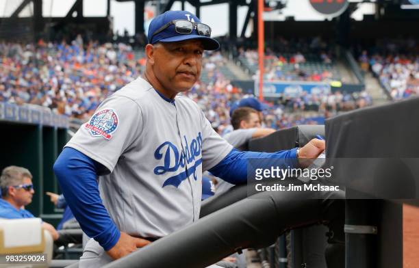 Manager Dave Roberts of the Los Angeles Dodgers looks on against the New York Mets at Citi Field on June 24, 2018 in the Flushing neighborhood of the...