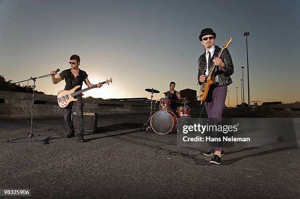 rock band performing on a highway, south africa - rock band stock pictures, royalty-free photos & images