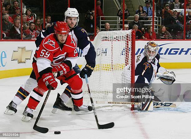 Chad LaRose of the Carolina Hurricanes sets up an offensive play inside the defensive zone of the Atlanta Thrashers during their NHL game on March...
