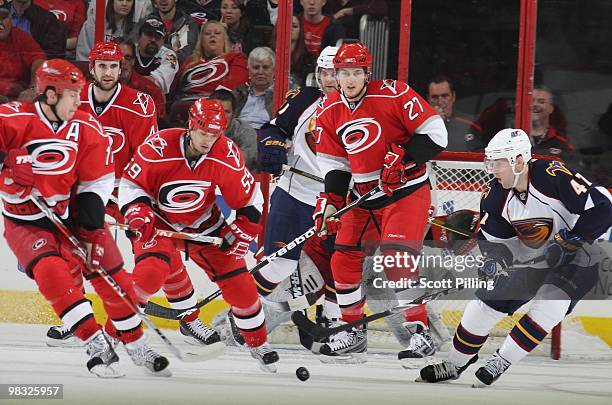 Rich Peverly of the Atlanta Thrashers plays the puck inside the defensive zone of the Carolina Hurricanes despite being out numbered during their NHL...