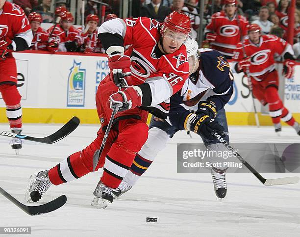 Jussi Jokinen of the Carolina Hurricanes takes a shot on net against the Atlanta Thrashers during their NHL game on March 27, 2010 at the RBC Center...