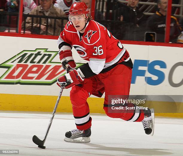 Jussi Jokinen of the Carolina Hurricanes skates the puck into the defensive zone of the Boston Bruins during their NHL game on March 16, 2010 at the...