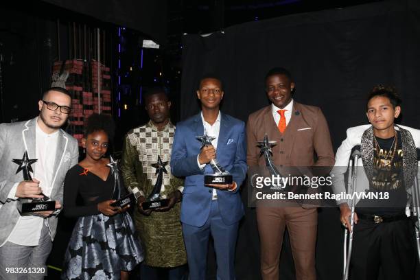 Heroes Now Award recipients Shaun King, Naomi Wadler, Mamadou Gassama, Justin Blackman, James Shaw Jr., and Anthony Borges are seen backstage at the...