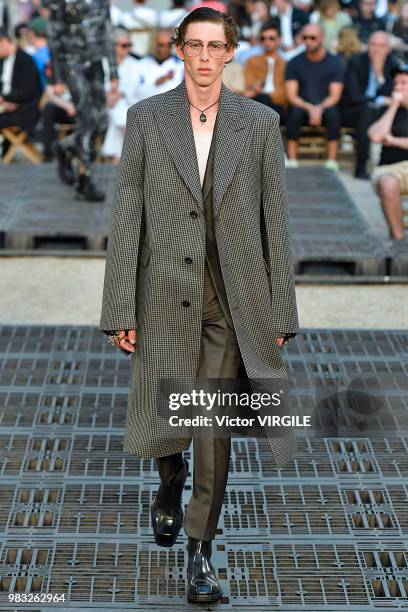 Model walks the runway during the Alexander McQueen Menswear Spring/Summer 2019 fashion show as part of Paris Fashion Week on June 22, 2018 in Paris,...