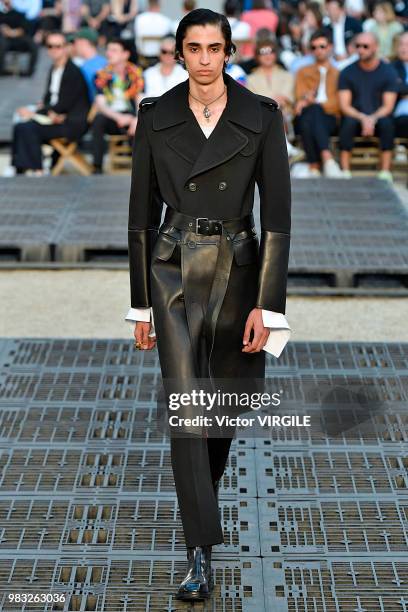 Model walks the runway during the Alexander McQueen Menswear Spring/Summer 2019 fashion show as part of Paris Fashion Week on June 22, 2018 in Paris,...